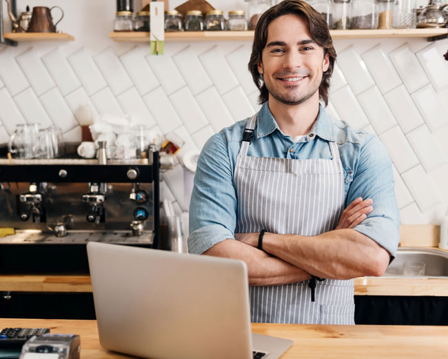 business owner looking happy after professional income tax return service